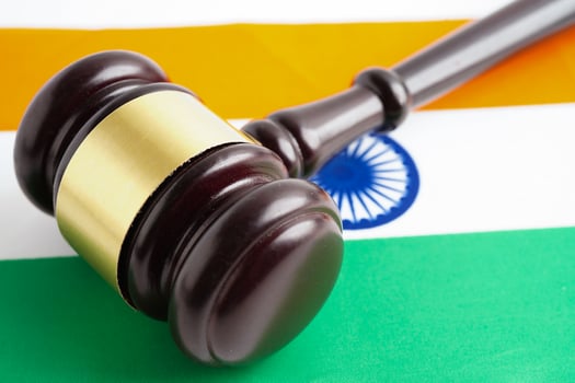 India, Legal, justice and agreement, wooden court gavel on flag. photo