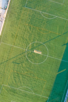 artificial grass soccer field seen from a drone, zenithal view photo