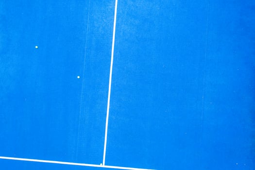 drone overhead view of a blue paddle tennis court, aerial shot photo