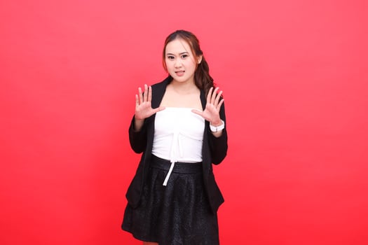 gesture of young asian office woman standing annoyed wearing black formal suit hands open to front, for corporate content, fashion, advertising, broadcast photo