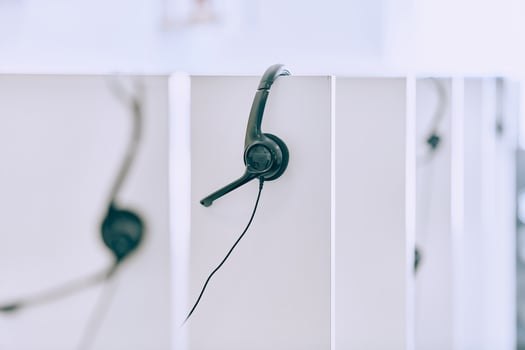 Close up of Headphones Awaiting the New Workday in the Call Center. photo