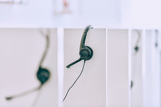 Close up of Headphones Awaiting the New Workday in the Call Center. photo