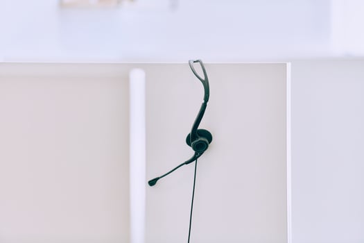 Close up of Headphones Awaiting the New Workday in the Call Center. photo