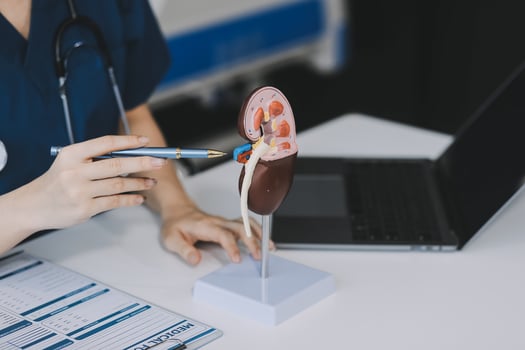 Portrait of young female doctor cardiologist working in office of modern clinic photo