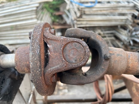 rusty joint of water tube machine on a wooden background photo