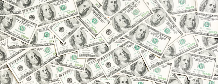 Top view of one hundred dollar banknotes made as a background. USD currency concept. Texture of American dollars photo