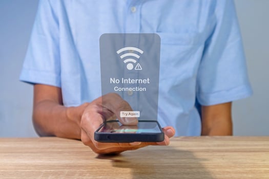 Man using a smartphone with no internet connection on screen. No internet access or bad connection concept. photo