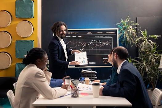 Corporation workers addressing project updates and objectives in a boardroom meeting, establishing budget allocation and other resources to achieve business goals. Employees under pressure. photo