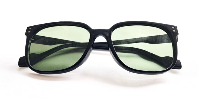 Close-Up Of black Sunglasses green. isolated on white background. photo