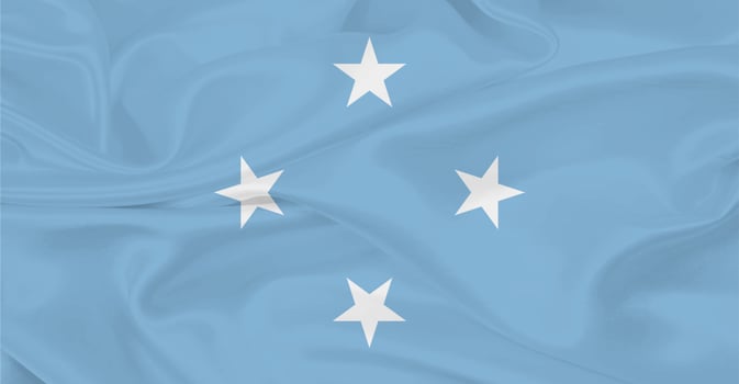 Flag of the Federated States of Micronesia Flying in the Air photo
