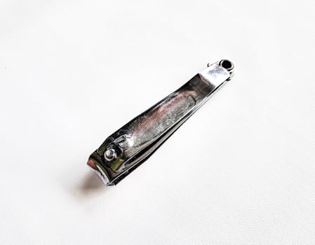 Cut nail clippers metal. Isolated on white background photo