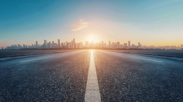 Empty Road Leading Towards City Skyline During Sunrise photo