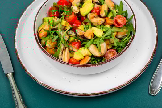 Salad with mussels, herbs and vegetables. photo
