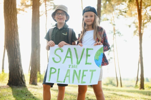Children are holding a poster Save the planet. photo