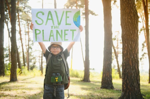 demonstration against global warming and pollution. Child boy making protest about climate change, plastic problems, global warming, pollution. Save the planet poster. Climate Strike. Eco Activism. photo