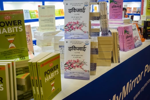 New Delhi, India, June 17 2024 - Variety of Books on shelf inside a book-stall at Delhi International Book Fair, Selection of books on display in Annual Book Fair at Bharat Mandapam complex photo
