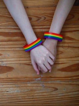 lgbtq couples hold hands to express their love and show couples confidence in their love for each other on their big day and forever Ideas for showing love and care for lgbtq couples by holding hands. photo