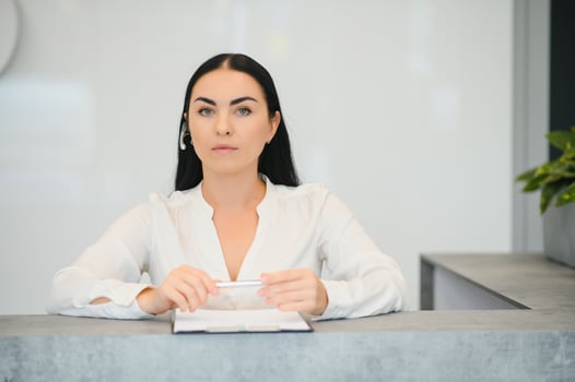 Picture of pretty receptionist at work. photo