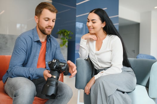Photographer communicates with the client in the office. photo
