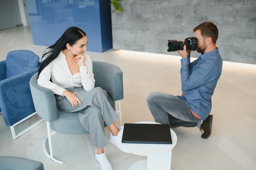 Young beautiful model posing for professional photographer in studio. photo