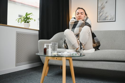 Young ill woman in bed at home. photo