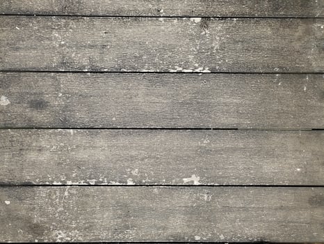 The wooden floor looks dirty and not clean. photo