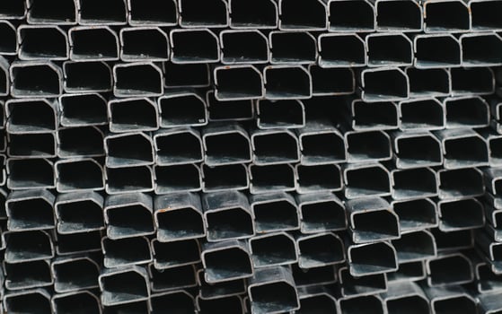 Aluminium profile for windows and doors manufacturing. Structural metal aluminium shapes. Aluminium profiles texture. Aluminium constructions factory photo
