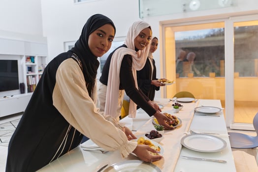 Group of young Arab women come together to lovingly prepare an iftar table during the sacred Muslim month of Ramadan, embodying the essence of communal unity, cultural tradition, and joyous photo