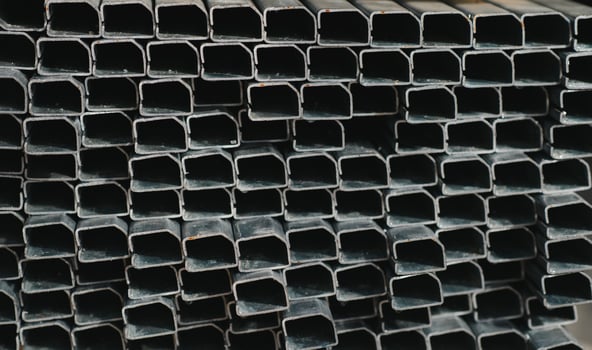 Stack of rolled metal products, perspective view of steel pipes of rectangular cross-section photo