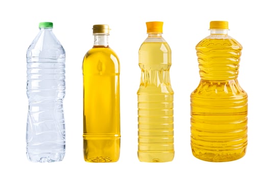 Water and Vegetable oil in different bottle for cooking isolated on white background. photo