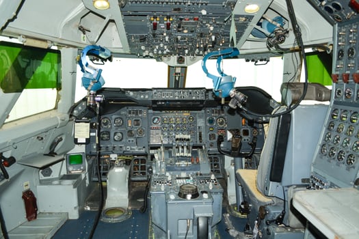 close up shot on helicopter console inside cockpit. Levers, parts and control buttons in the cockpit of an aircraft. photo