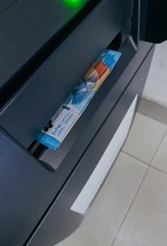 withdraw Indonesian rupiah money from ATM machine photo