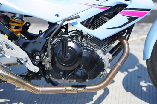 close up of a 4-Stroke underbone category motorbike engine photo
