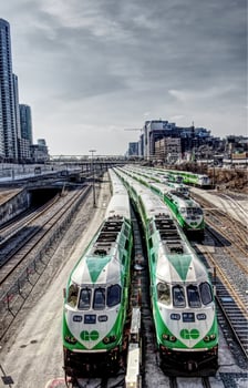Toronto, Canada - March 20, 2019 - Go trains stopping at a Railway station at sunny day photo