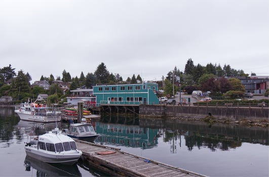 Ucluelet, Vancouver Island, Canada - June 17, 2019 - Small Dock for fishing boats in the middle of the Village at early morning photo