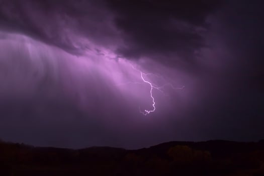 lightning in the night sky photo