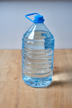 5 liter blue plastic water bottle photo