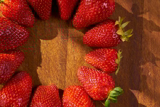 organic strawberries on a wooden cutting board photo
