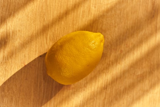 Slices of organic lemon on a wooden cutting board photo