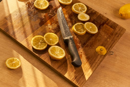 Slices of organic lemon on a wooden cutting board photo