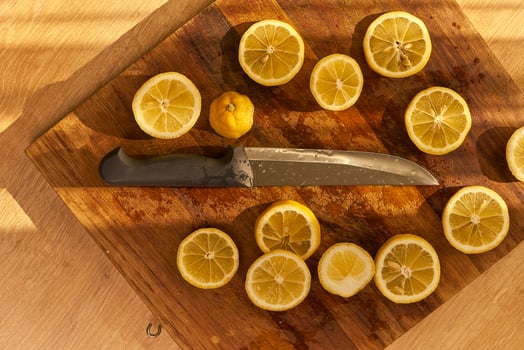 Slices of organic lemon on a wooden cutting board photo