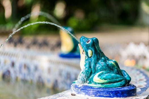 Glazed ceramic frog in a fountain, Maria Luisa park, Seville, Spain photo