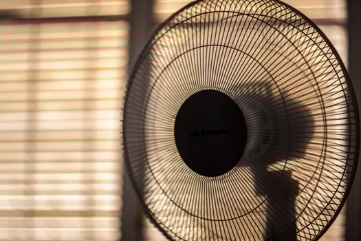 Electric Fan Operating in Cozy Sevilla Room on a Sunny Summer Day photo