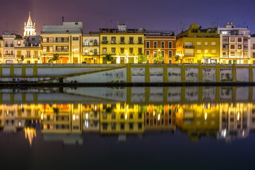 Twilight Reflections on Calle Betis, Seville photo