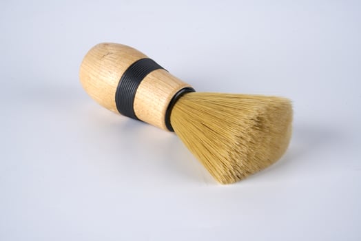 shaving brush on a white background photo
