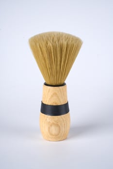 shaving brush on a white background photo
