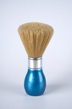shaving brush on a white background photo