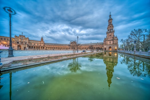Stunning Twilight Scene at Historic Plaza de Espana with Reflective Waters, Seville, Spain photo