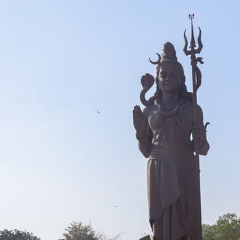Big statue of Lord Shiv near Delhi International airport, Delhi, India, Lord Shiv big statue touching sky at main highway Mahipalpur, Delhi photo