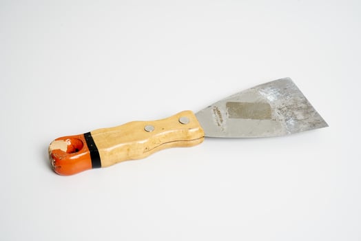 construction spatula with wooden handle photo